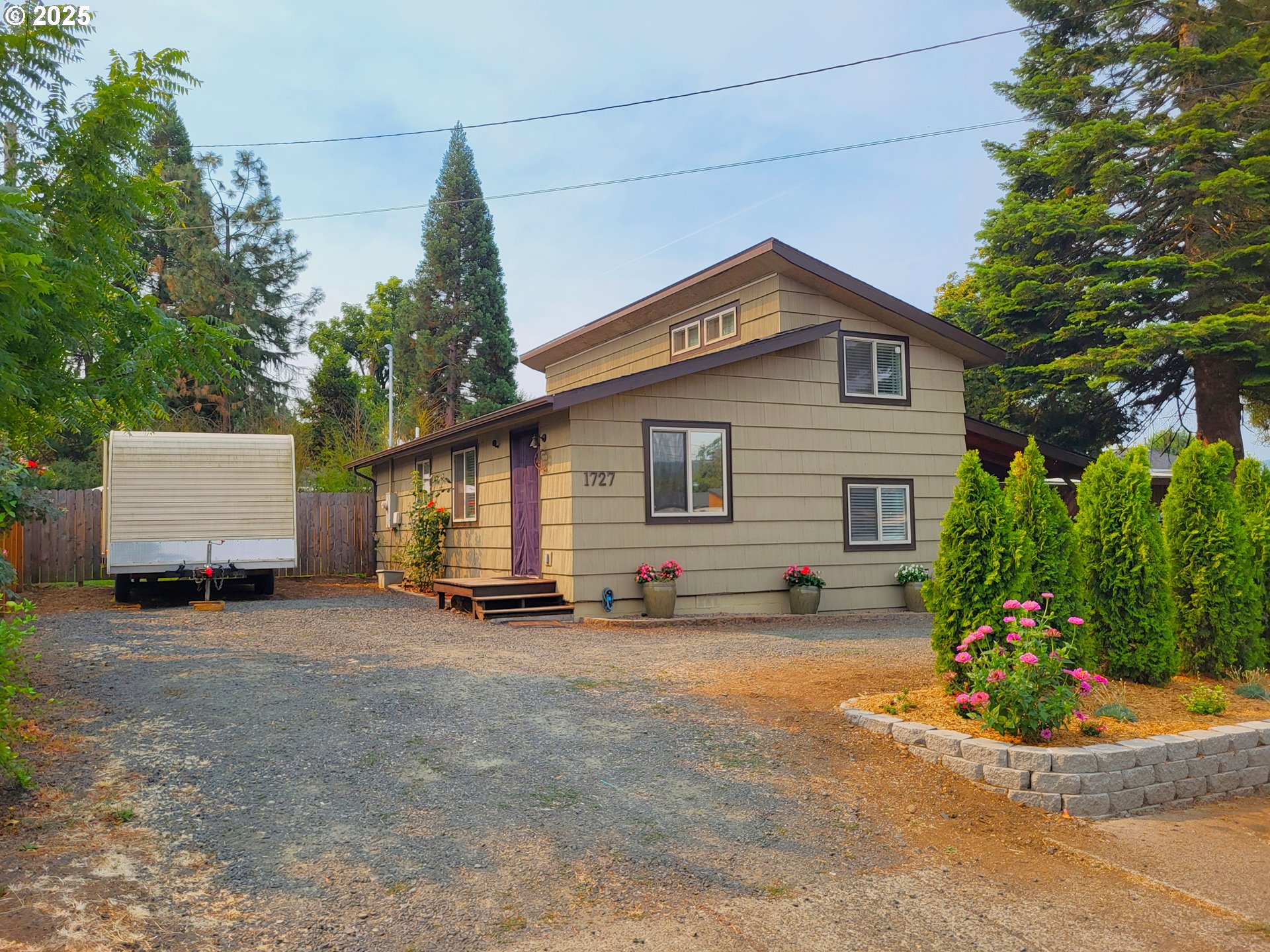 1727 East Washington Avenue Cottage Grove, OR 97424 - Photo 20 of 20 a view of a house with a patio and a yard