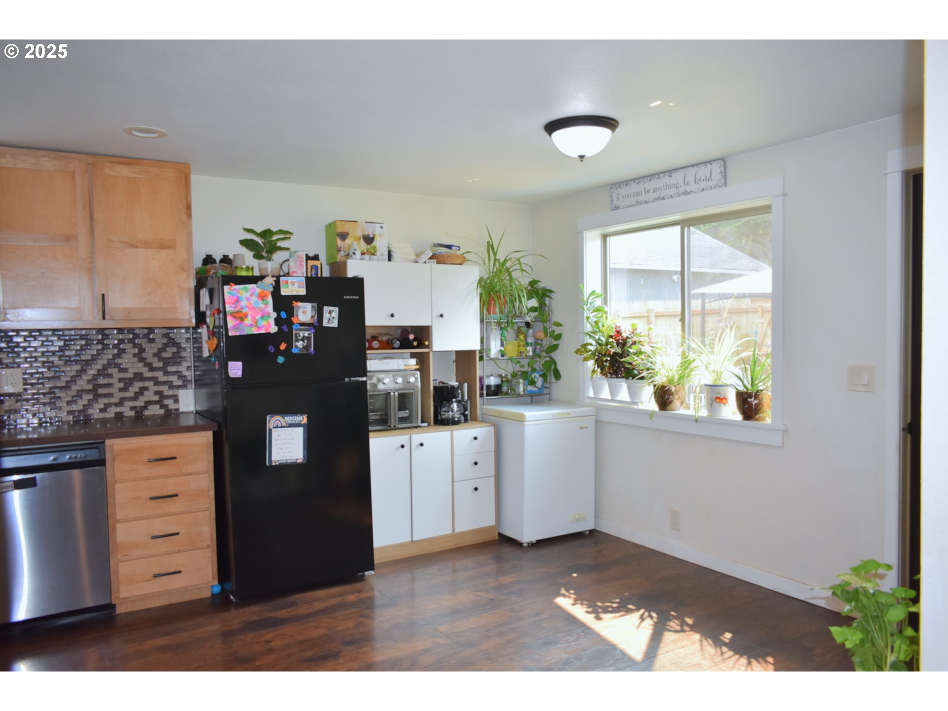 1727 East Washington Avenue Cottage Grove, OR 97424 - Photo 6 of 20 a kitchen with stainless steel appliances granite countertop a stove a sink and a refrigerator