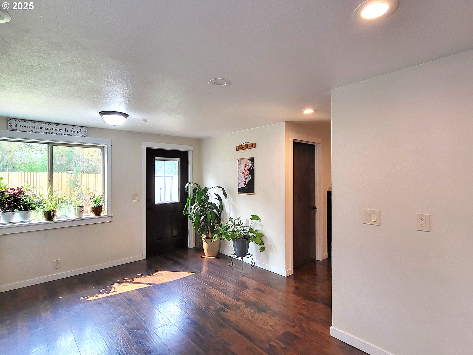 1727 East Washington Avenue Cottage Grove, OR 97424 - Photo 8 of 20 a view of an empty room and wooden floor