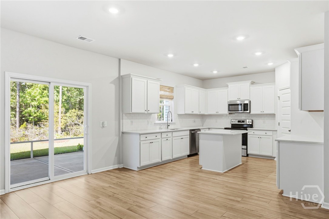 136 Binscombe Lane Pooler, GA 31322 - Photo 11 of 35 Gourmet Kitchen that Flows to Screen Porch