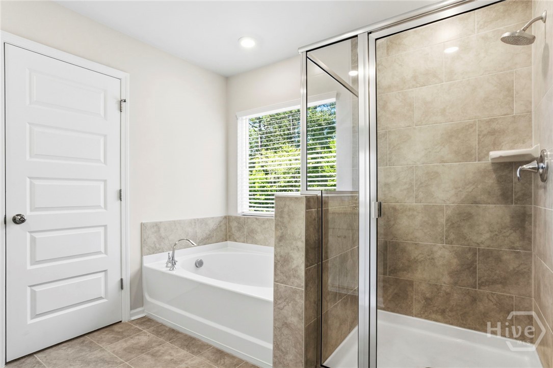 136 Binscombe Lane Pooler, GA 31322 - Photo 23 of 35 Owner's Luxe Bath with Garden Tub and Separate Shower