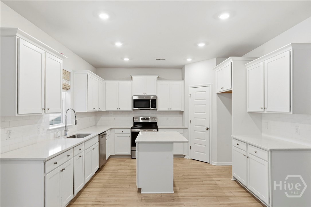 136 Binscombe Lane Pooler, GA 31322 - Photo 10 of 35 Gourmet Kitchen with Quartz Countertops and Island