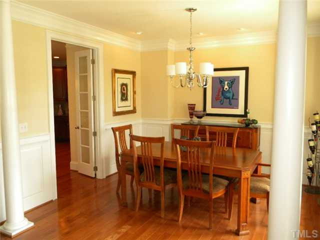 3704 Laurel Hills Road Raleigh, NC 27612 - Photo 5 of 25 Have dinner parties in the large formal dining room with heavy moldings including wainscoting, and 3 piece crown molding. Accent eyeball lighting for your displays areas that you would like to highlight. Dining Room