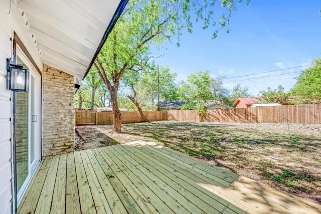 a view of a backyard of the house