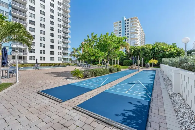 a view of a backyard with sitting area