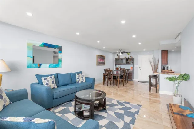 a living room with furniture and a table
