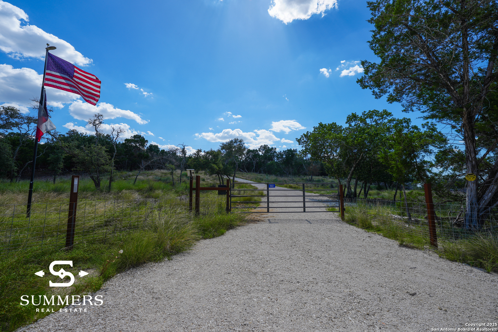 502 Waring Welfare Road Boerne, TX 78006 - Photo 1 of 33 a backyard of a house with lots of green space and outdoor seating