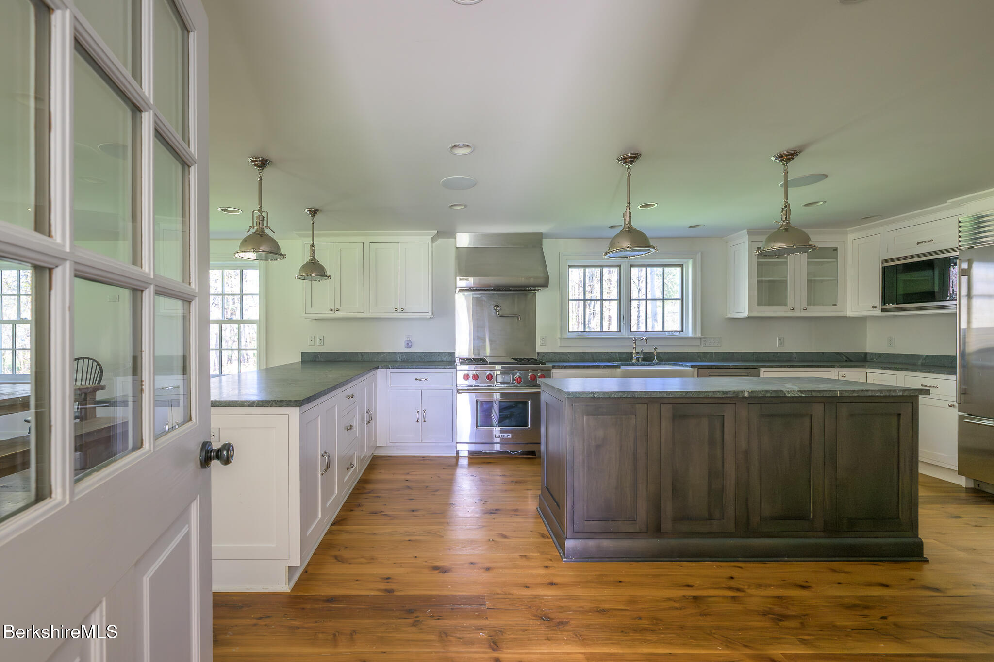 304 Hickey Hill Road Sheffield, MA 01257 - Photo 19 of 60 a view of a kitchen with a sink and wooden floor