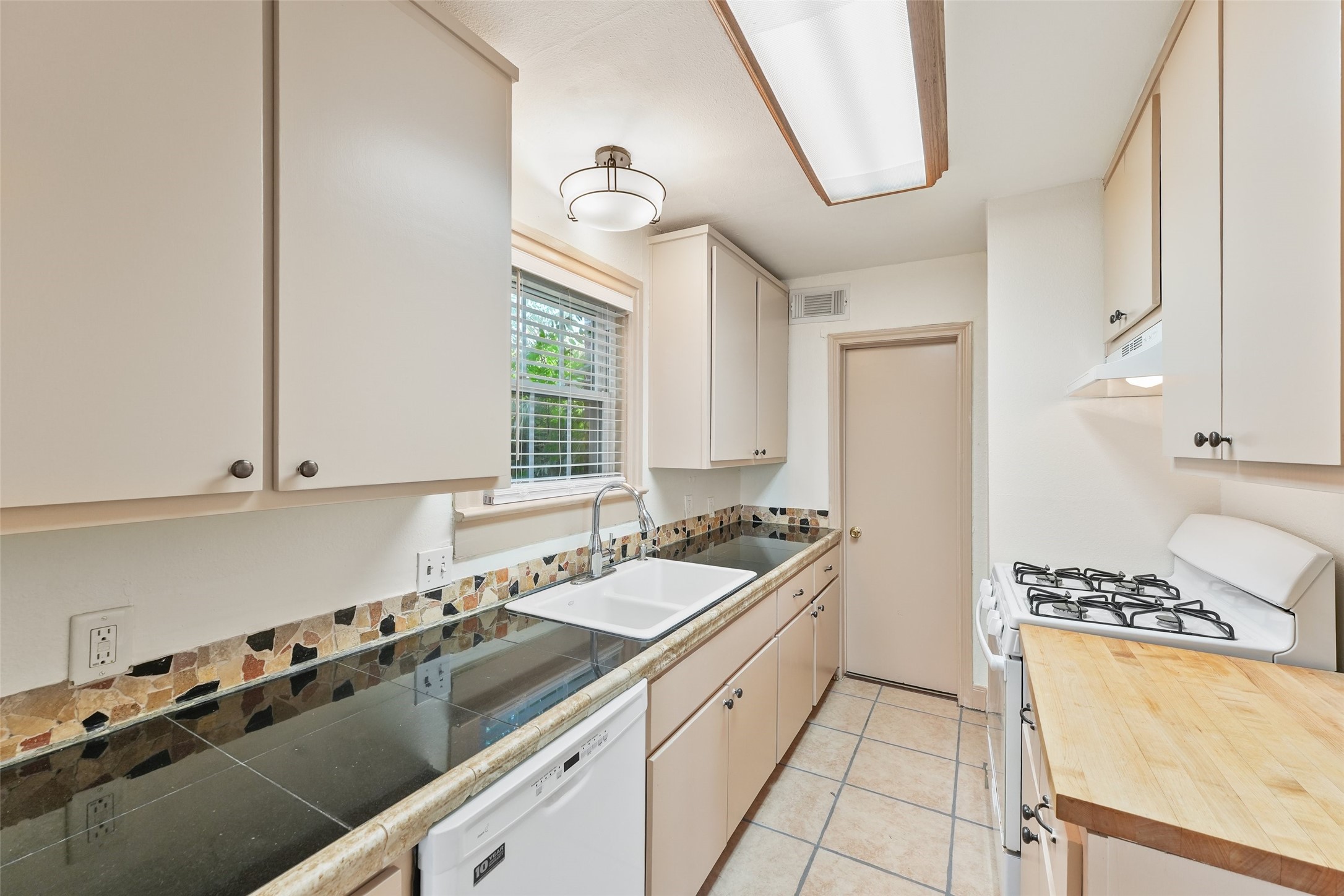 1637 Castle Court Houston, TX 77006 - Photo 2 of 14 Charming kitchen with big pantry through that door.
