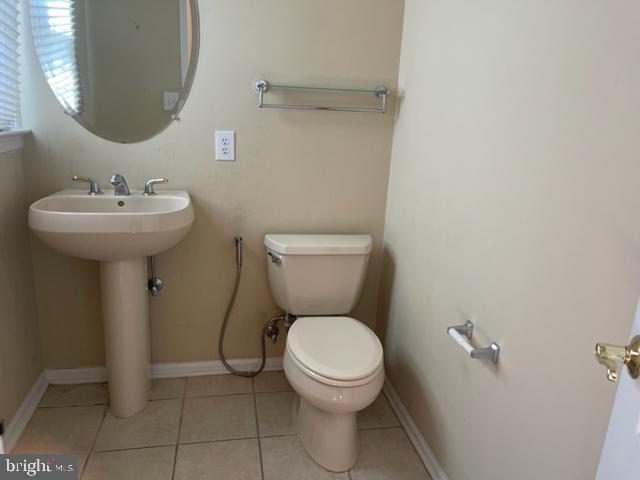 11 Tree Swallow Drive Princeton, NJ 08540 - Photo 19 of 29 a bathroom with a toilet sink and mirror