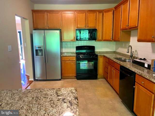 11 Tree Swallow Drive Princeton, NJ 08540 - Photo 7 of 29 a kitchen with stainless steel appliances granite countertop a refrigerator stove and sink