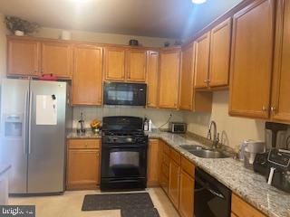 11 Tree Swallow Drive Princeton, NJ 08540 - Photo 9 of 29 a kitchen with stainless steel appliances granite countertop a stove a sink dishwasher and a refrigerator with cabinets