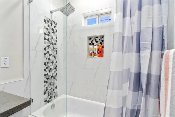 a bedroom with a bed and a table