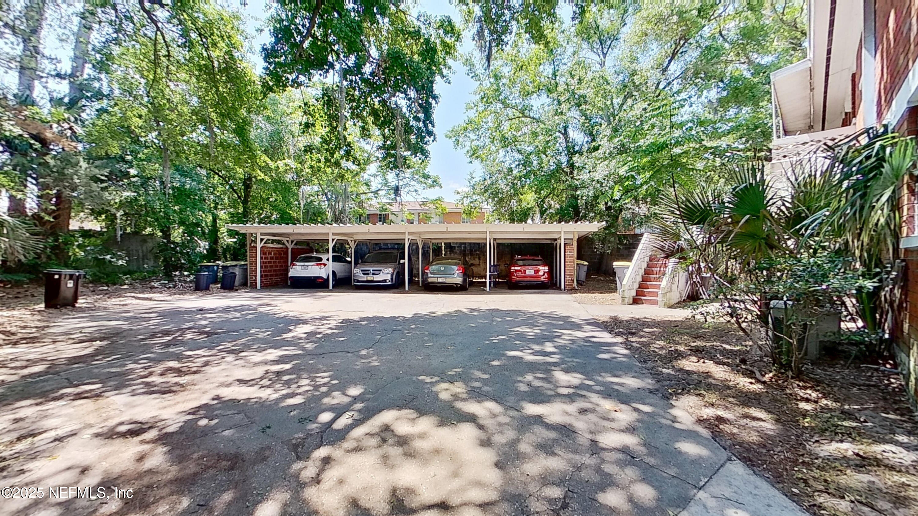 3034 Belden Street, Unit 3 Jacksonville, FL 32207 - Photo 12 of 13 a view of house with outdoor space and car parked