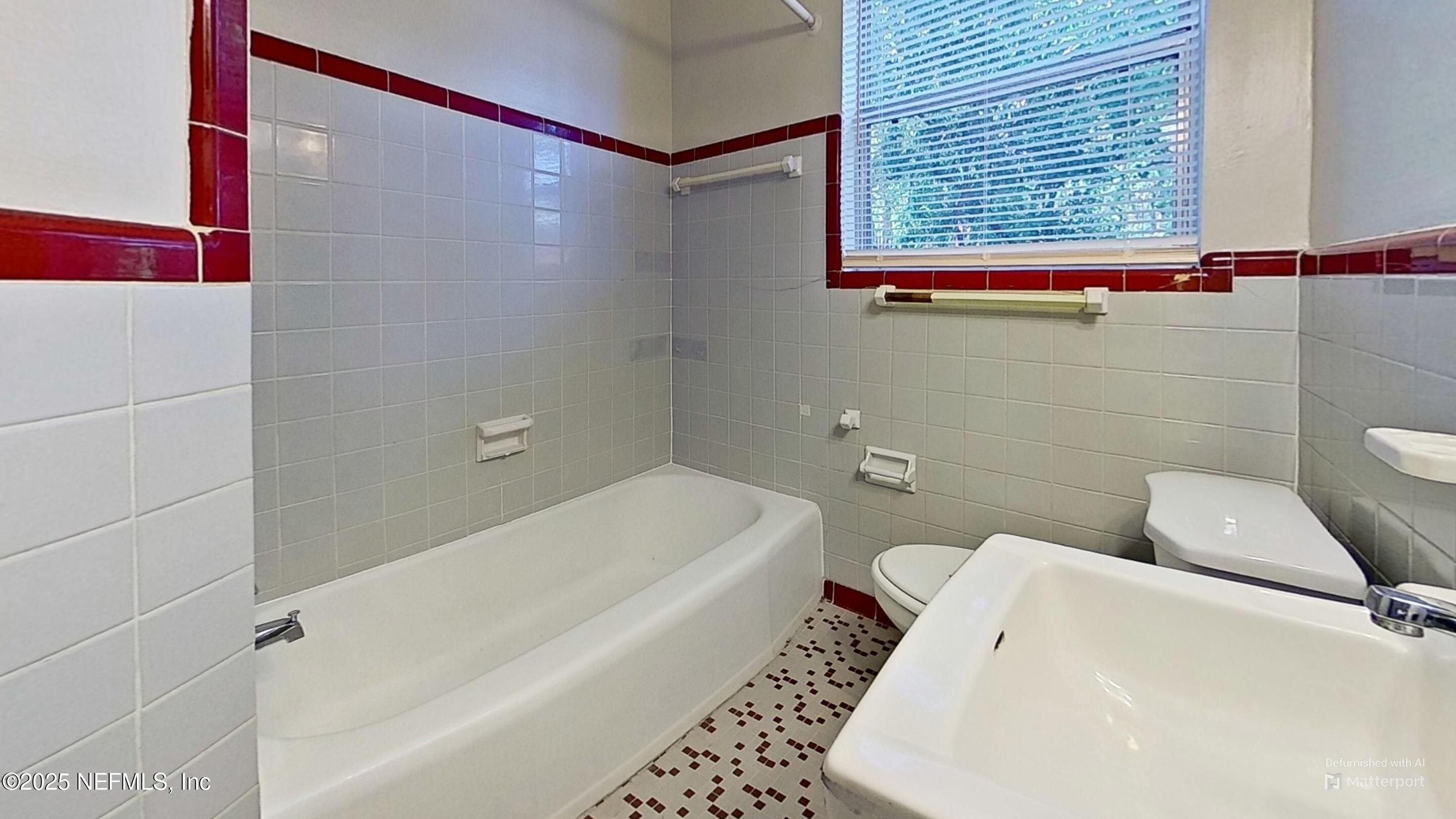 3034 Belden Street, Unit 3 Jacksonville, FL 32207 - Photo 10 of 13 a bathroom with a sink and a toilet