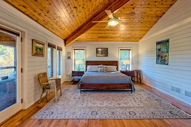 a view of a livingroom with furniture and a flat screen tv