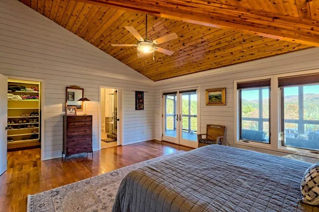 a living room with furniture and a backyard