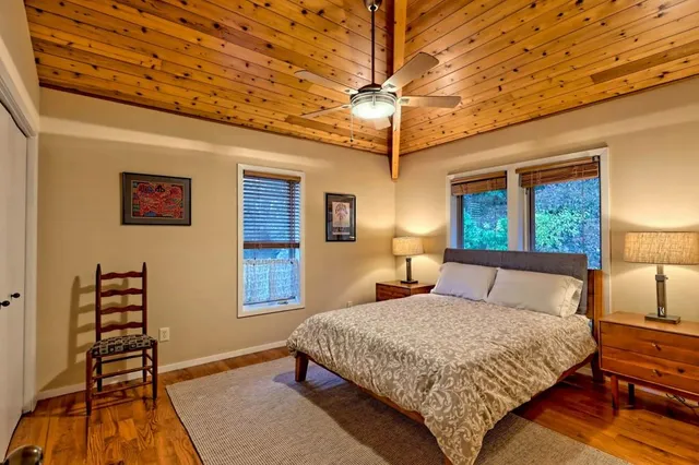 a bathroom with a double vanity sink a mirror and shower