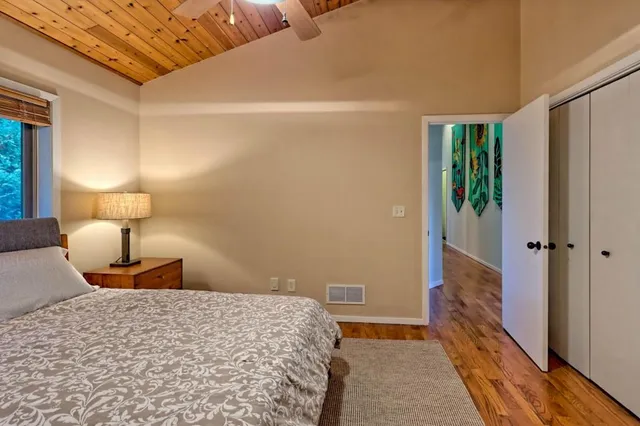 a bedroom with a bed and a view of bathroom