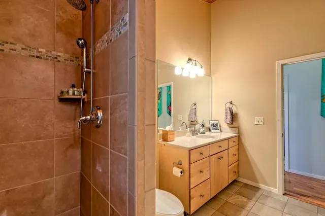 a bathroom with a sink a vanity and a mirror