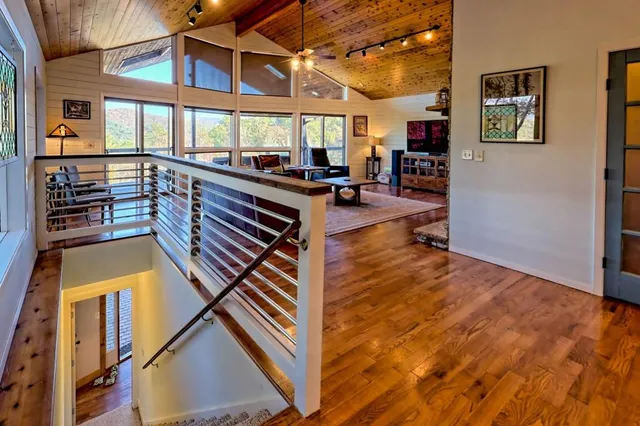 a view of a room with toys and wooden floor