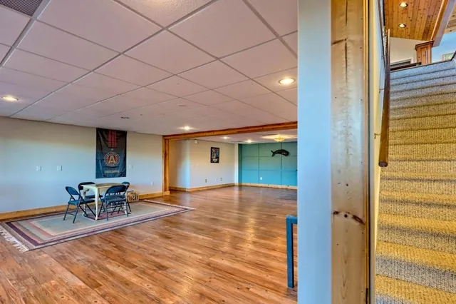 a bedroom with a bed and a night stand