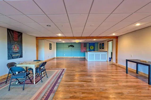 a bathroom with a sink mirror and a shower