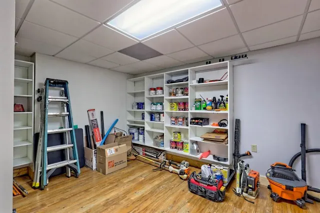 a bedroom with furniture and a wooden floor
