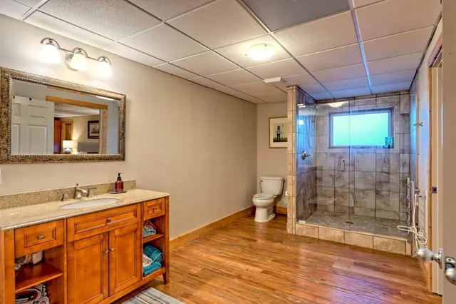 a view of a porch with wooden floor and furniture