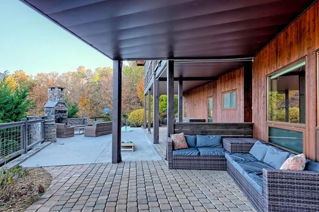 a view of a house with a tree in the background