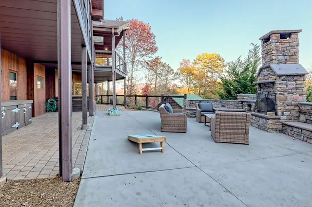 a bedroom with a large bed and wooden floor
