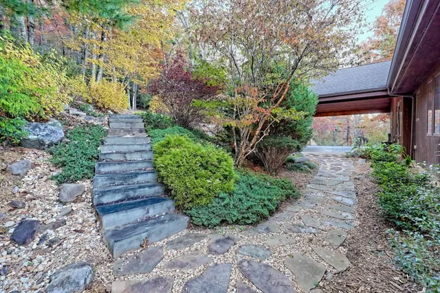 a front view of a house with garden