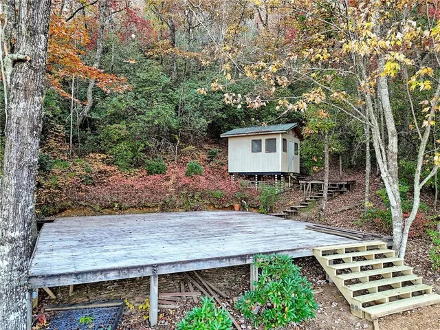 a bathroom with a toilet a sink and shower