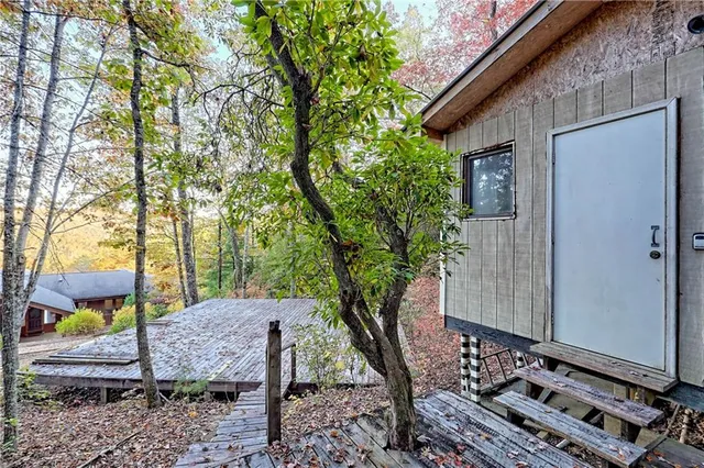 a view of a chairs in backyard of the house