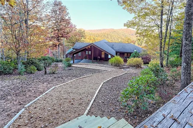 a front view of a building with a yard