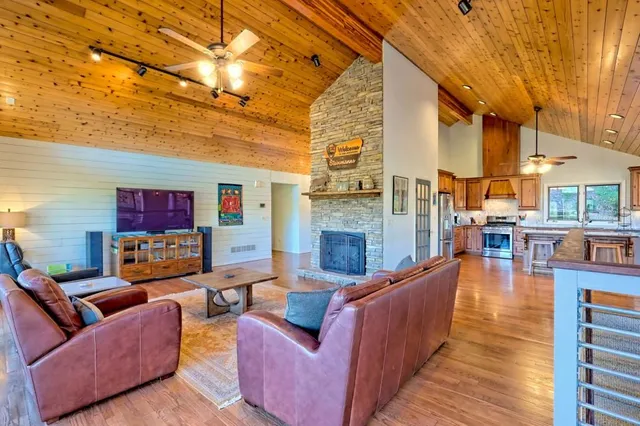 a outdoor living space with patio furniture and a fireplace