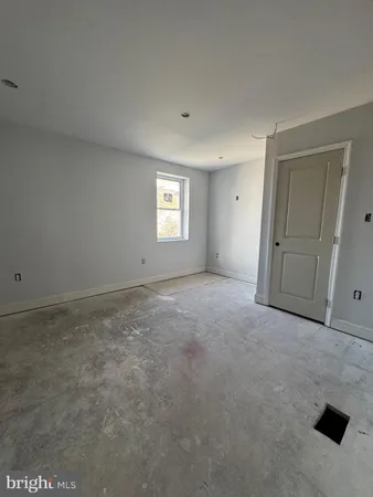 a view of a big room with windows