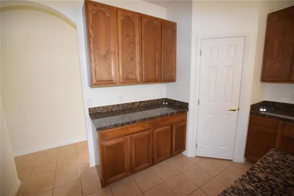 a view of a storage and utility room with a sink