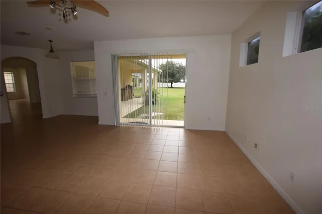 a view of an empty room and bathroom