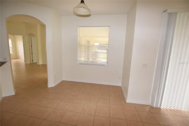 an empty room that has a window