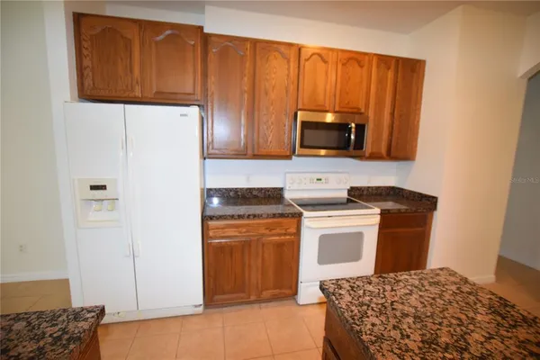 a kitchen with a stove and a microwave