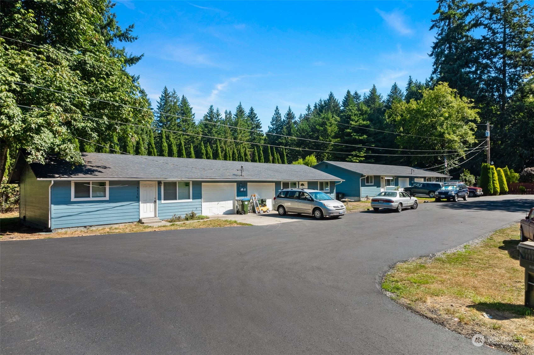 a wooden bench sitting in front of a building