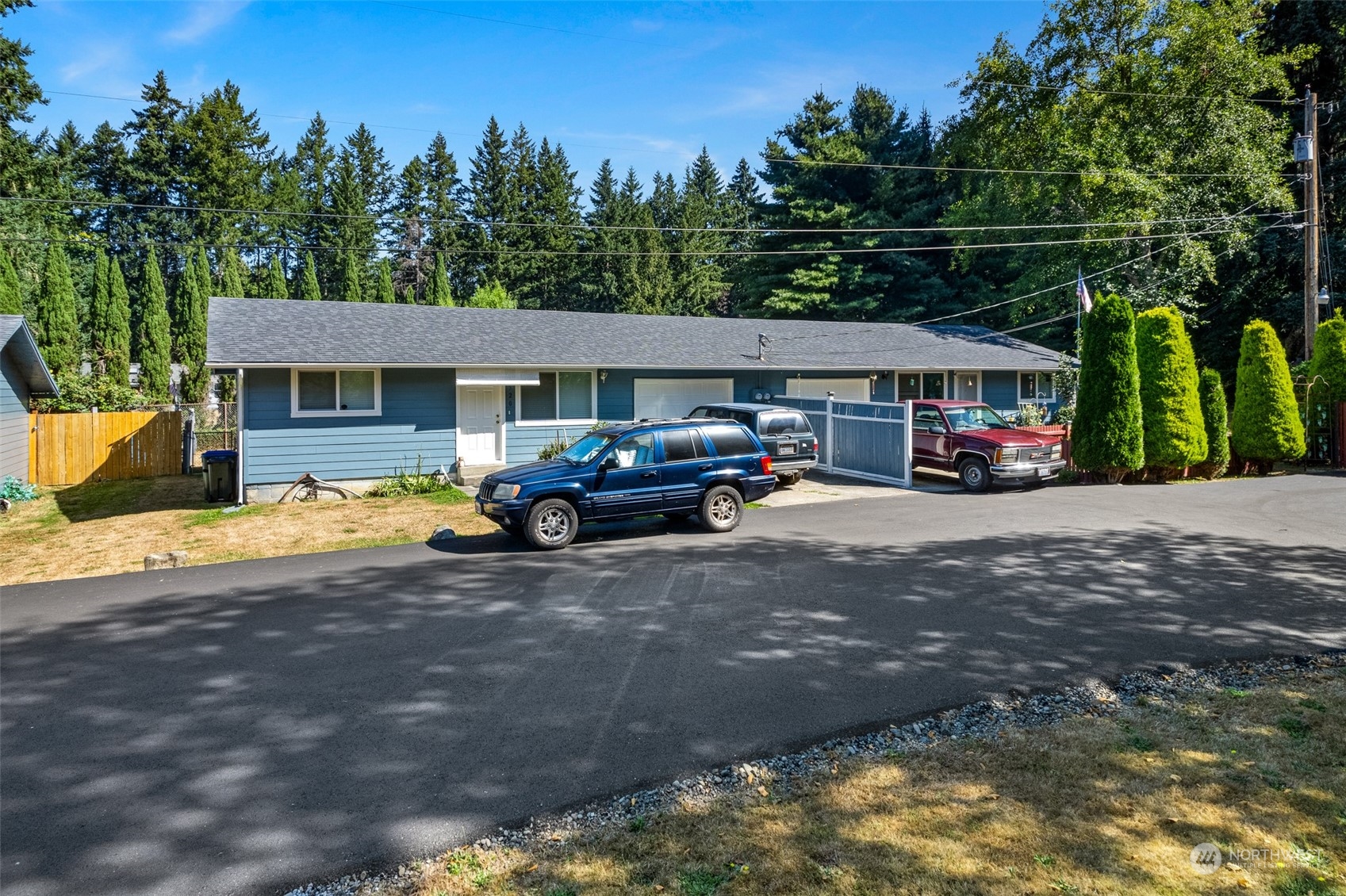 4520 Cooper Point Road Northwest Olympia, WA 98502 - Photo 2 of 10 a view of a car park in front of a house