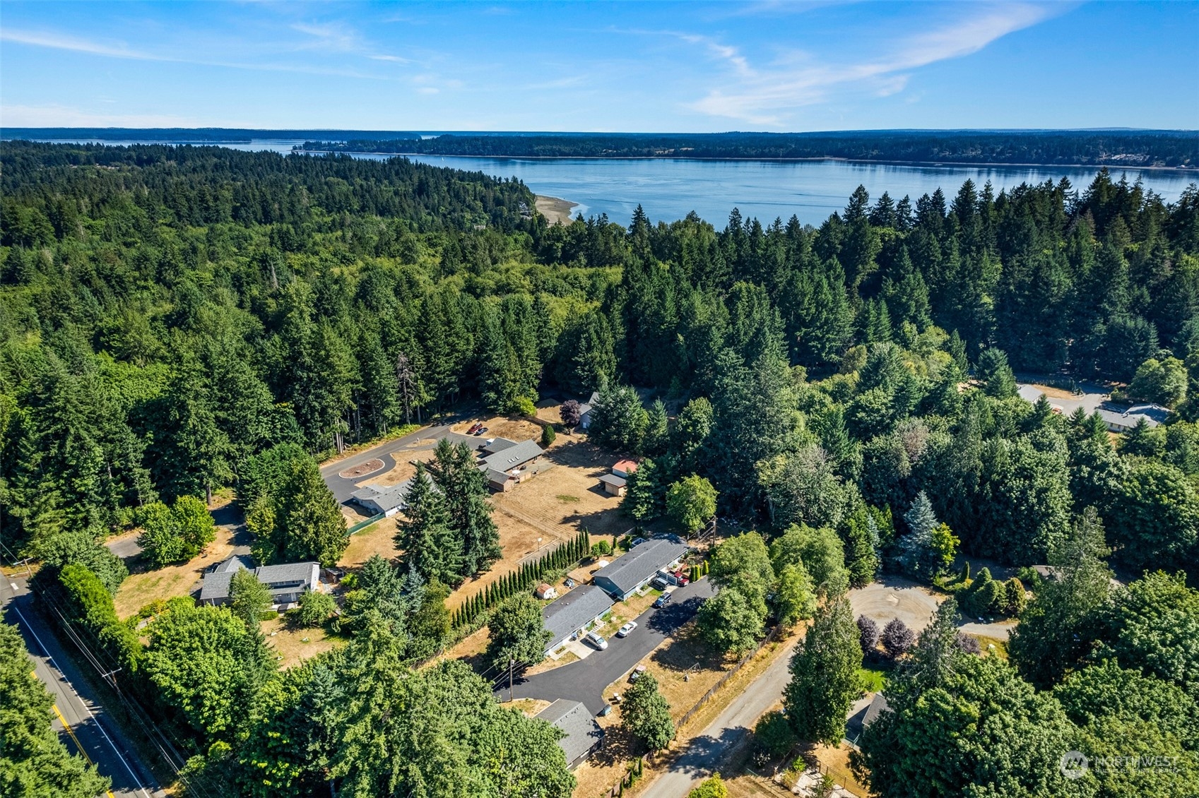4520 Cooper Point Road Northwest Olympia, WA 98502 - Photo 9 of 10 an aerial view of a house with a yard