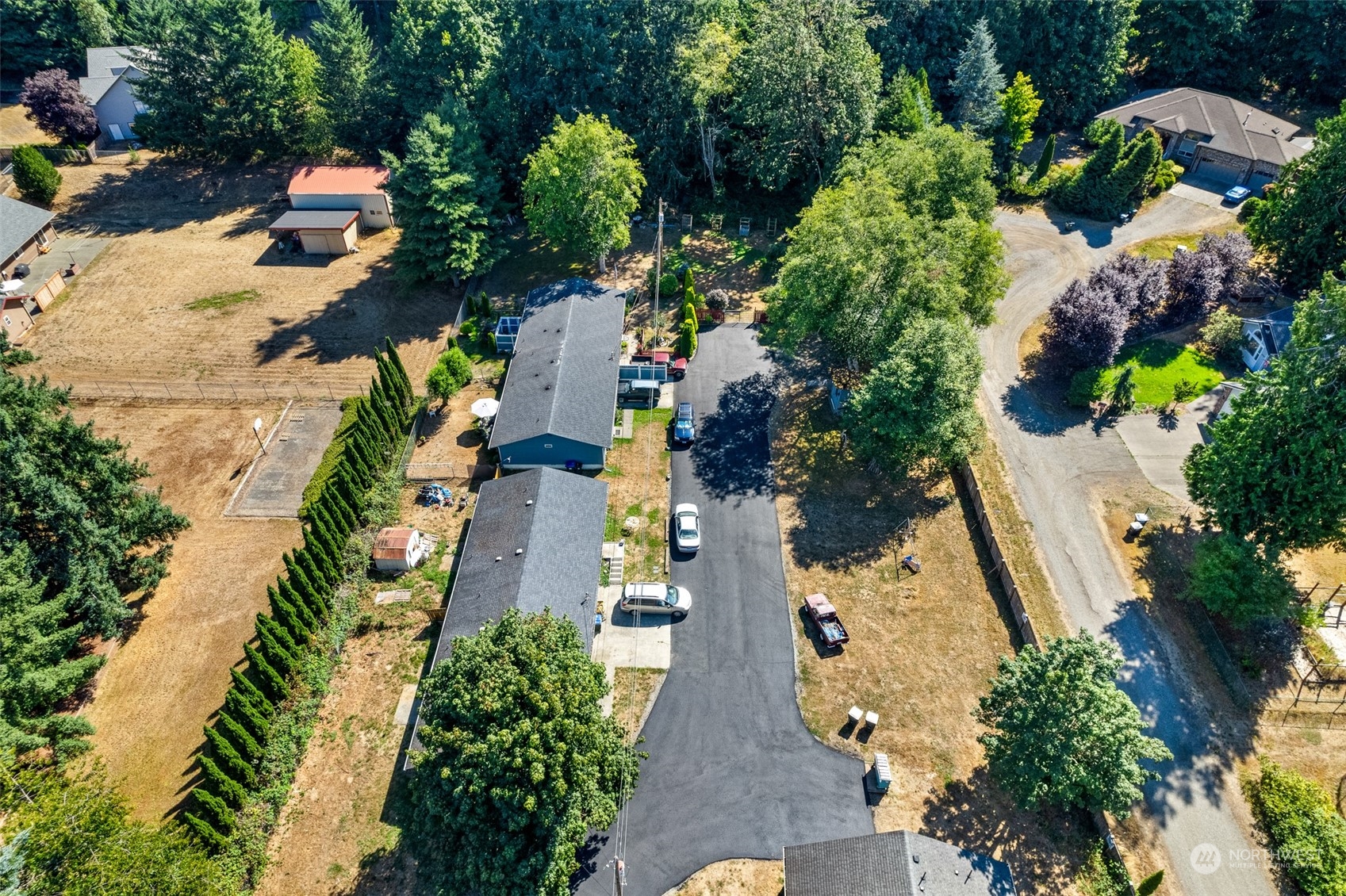 4520 Cooper Point Road Northwest Olympia, WA 98502 - Photo 10 of 10 an aerial view of houses with yard