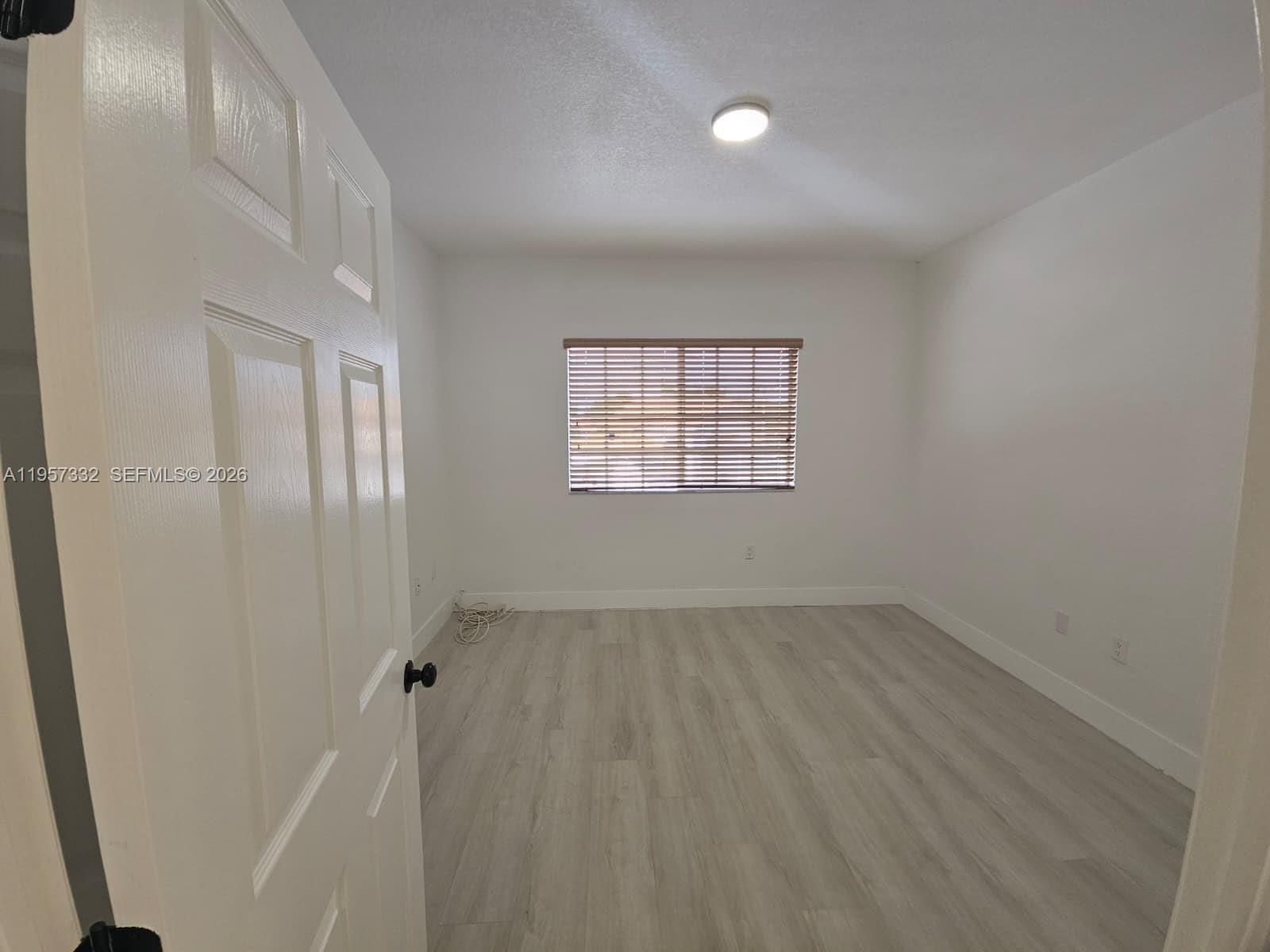 10919 Southwest 182nd Lane Miami, FL 33157 - Photo 22 of 29 an empty room with windows