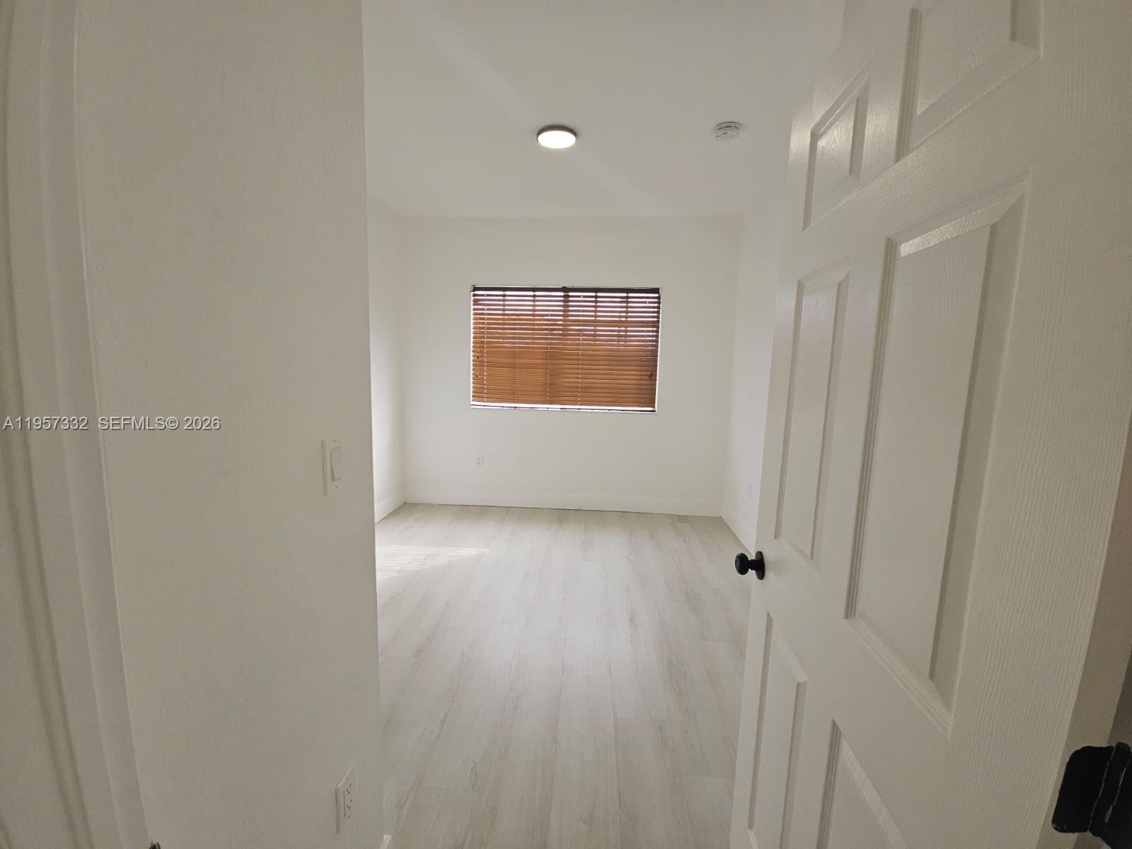 10919 Southwest 182nd Lane Miami, FL 33157 - Photo 27 of 29 a view of an empty room and window