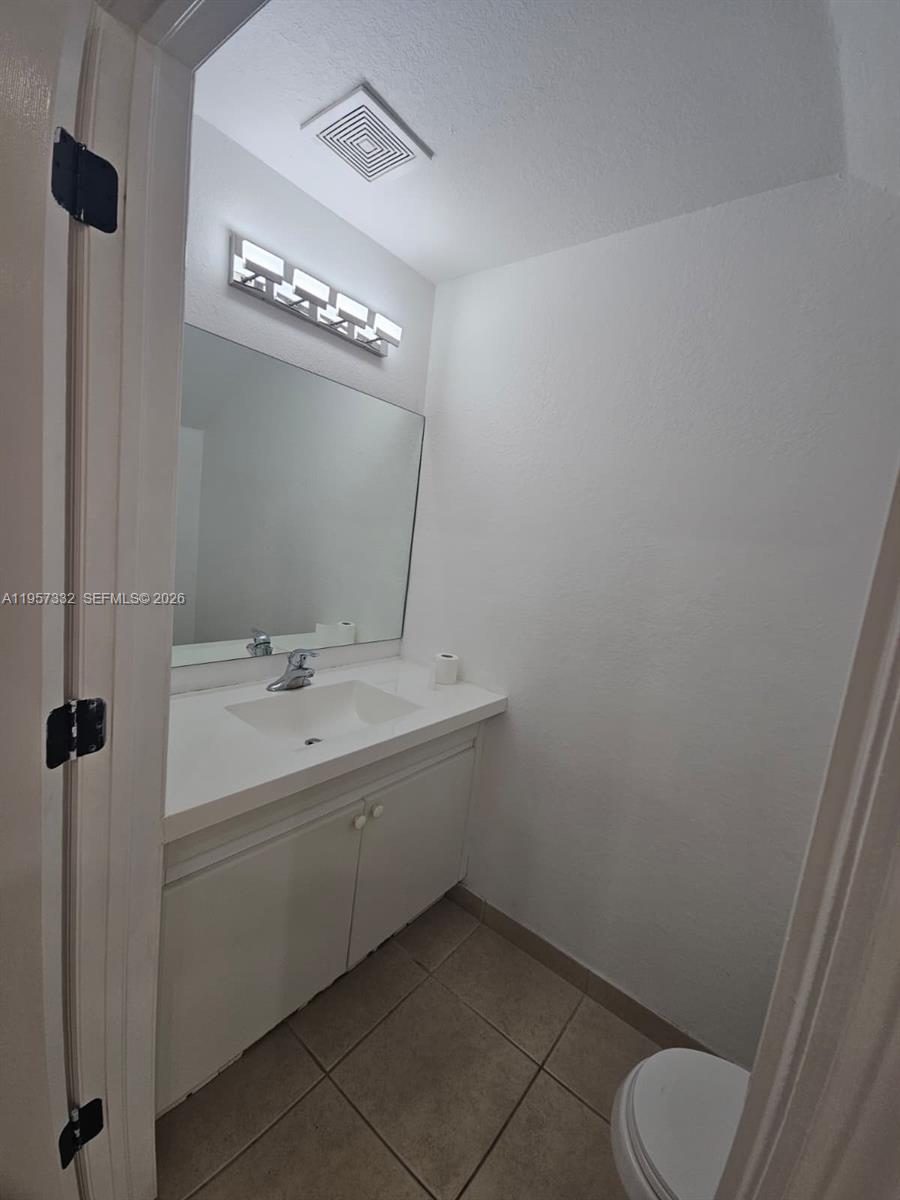 10919 Southwest 182nd Lane Miami, FL 33157 - Photo 5 of 29 a bathroom with a sink toilet and shower
