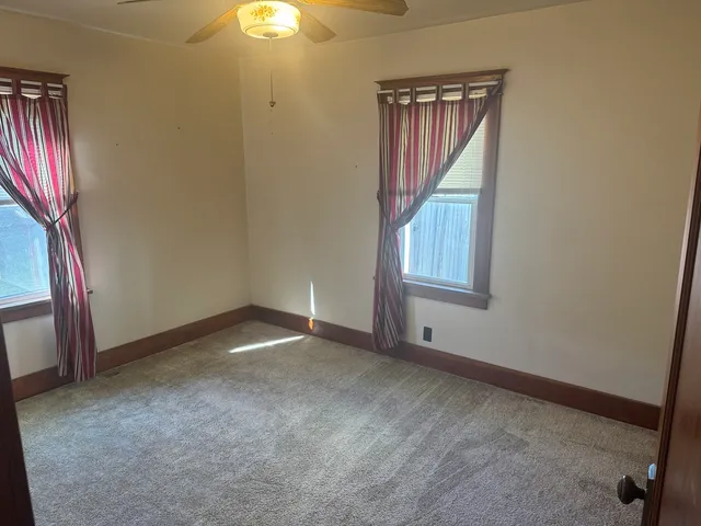 a bathroom with a bathtub and window