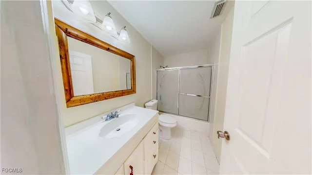 a kitchen with a stove a sink and a refrigerator